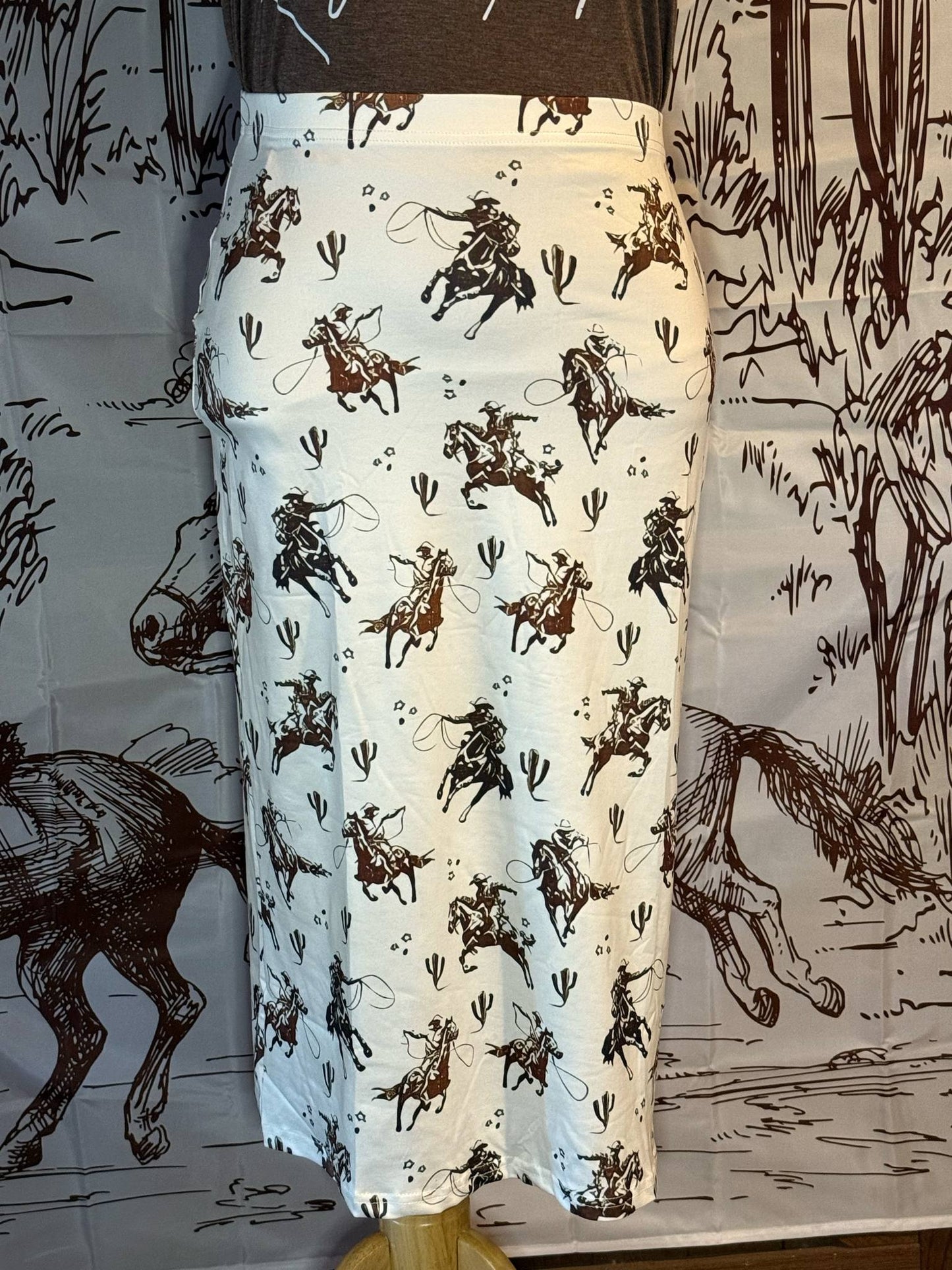 White midi skirt with brown and black cowboy roper print, made from soft t-shirt fabric
