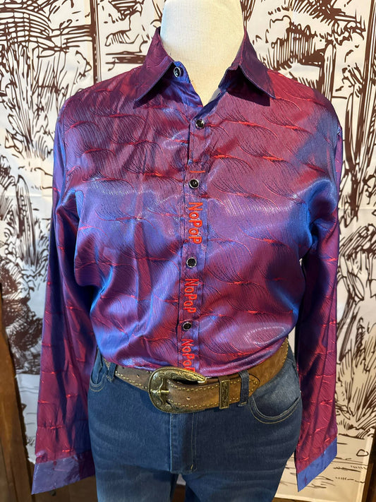 A shiny purple and red textured western-style NoPop shirt with embroidered "NoPop" closure, displayed on a mannequin with denim jeans and a tooled leather belt.