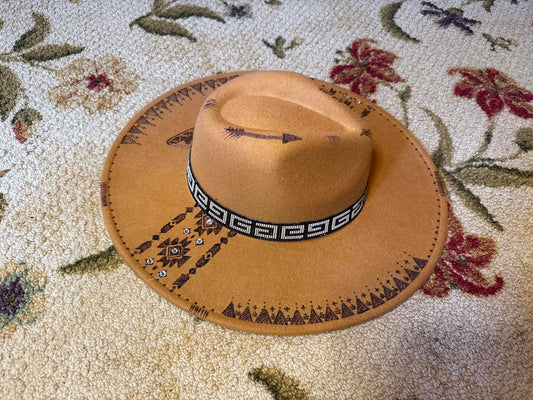 Hand-burned tan fedora hat with thunderbird and tribal designs, part of the Amira Collection by Seewhatshangin