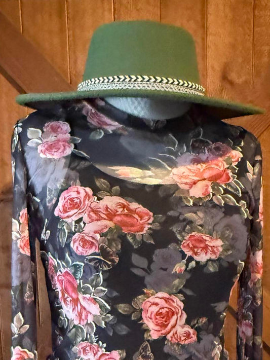 Green wide-brimmed western hat with black and white braided trim from SEEWHATSHANGIN’