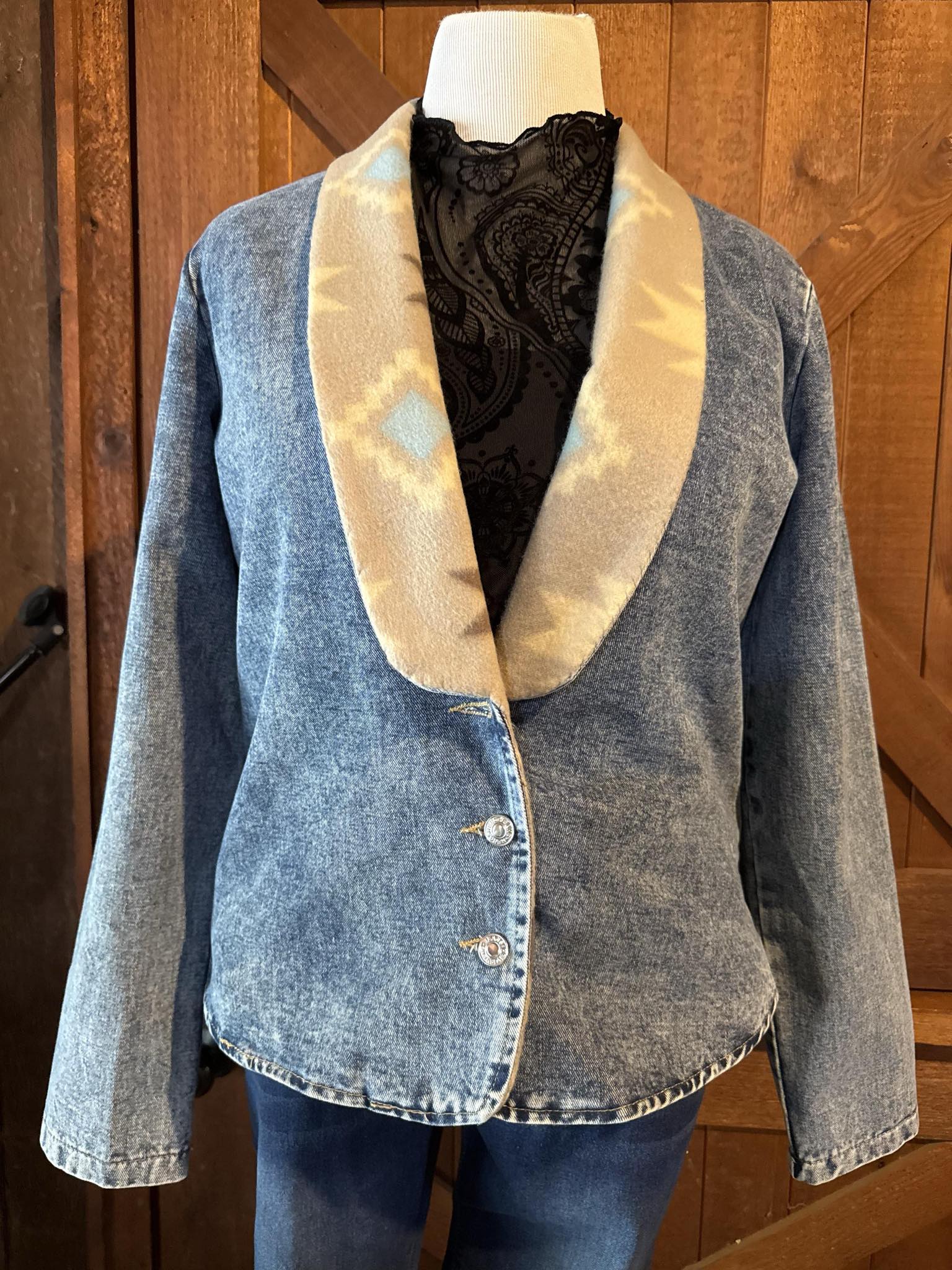 Light wash denim jacket with soft cream and sky blue southwestern fleece shawl collar and silver buttons, handcrafted and one of a kind in size Large.