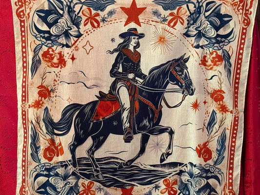 Cream-colored cowboy scarf featuring a cowgirl on horseback surrounded by floral and Western motifs.