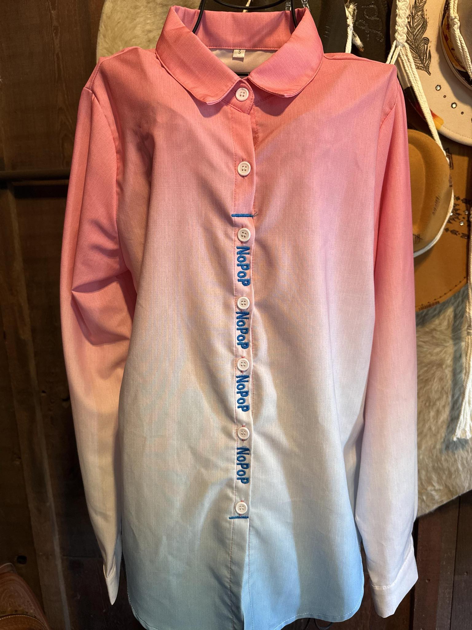 Pink and blue ombre NoPop barrel racing shirt with blue embroidery, size small, stretchy 100% polyester.

