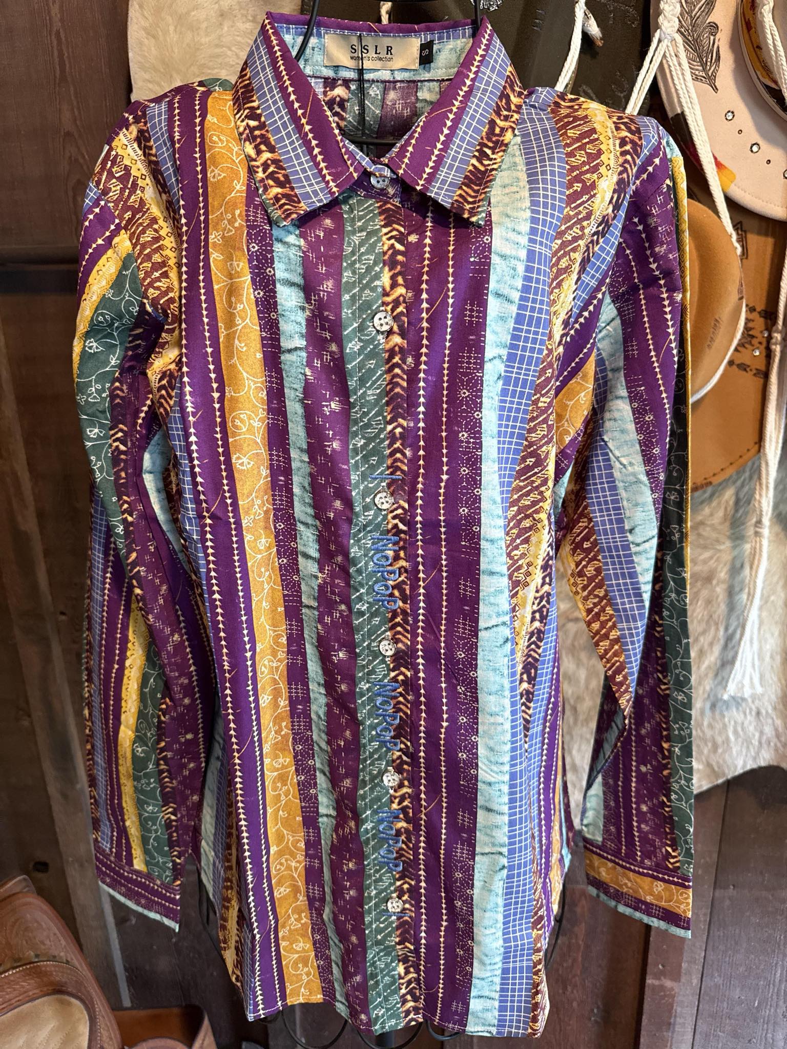 Colorful striped barrel racing NoPop shirt with purple, yellow, teal, and blue pattern, size small, 100% cotton.