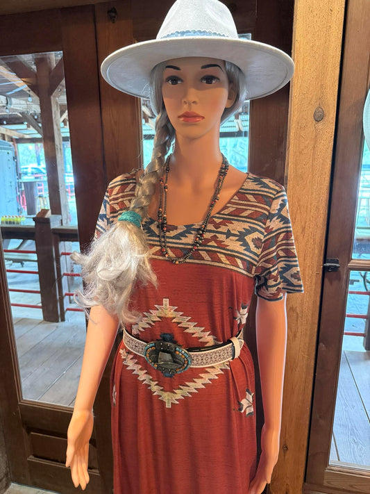 Rust-colored Aztec print maxi dress with short sleeves and western belt, styled with a white felt hat - SEEWHATSHANGIN' Boutique