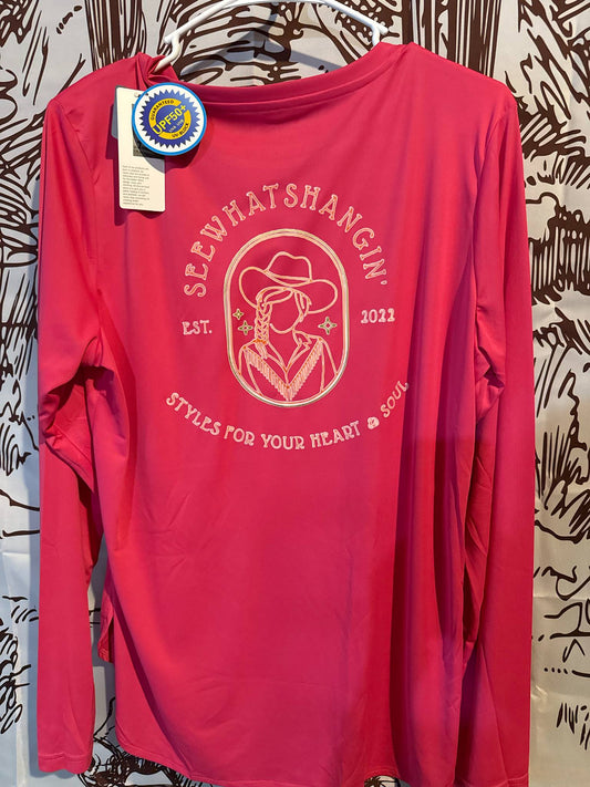 Long sleeve SPF 50 performance shirts in green and pink from See What’s Hangin’, featuring lightweight, quick-dry fabric and cowboy cowgirl branding.