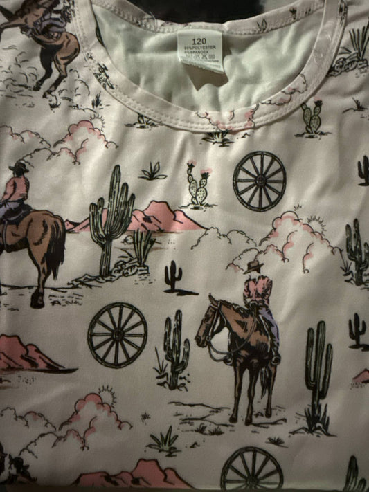 Kids pajama set with cowboy, cactus, and western desert print on cream background