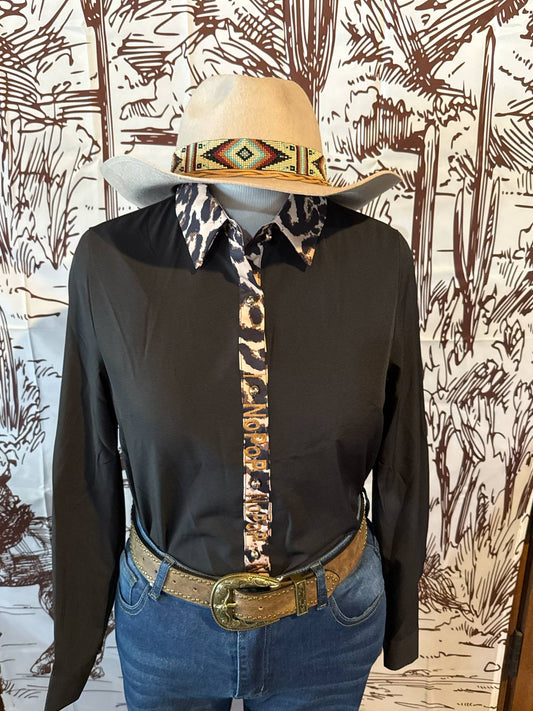 Black NoPop button-up shirt with a leopard print collar and button placket, shown on a mannequin styled with a tooled leather belt, denim jeans, and a cream-colored hat with a tribal beaded band.