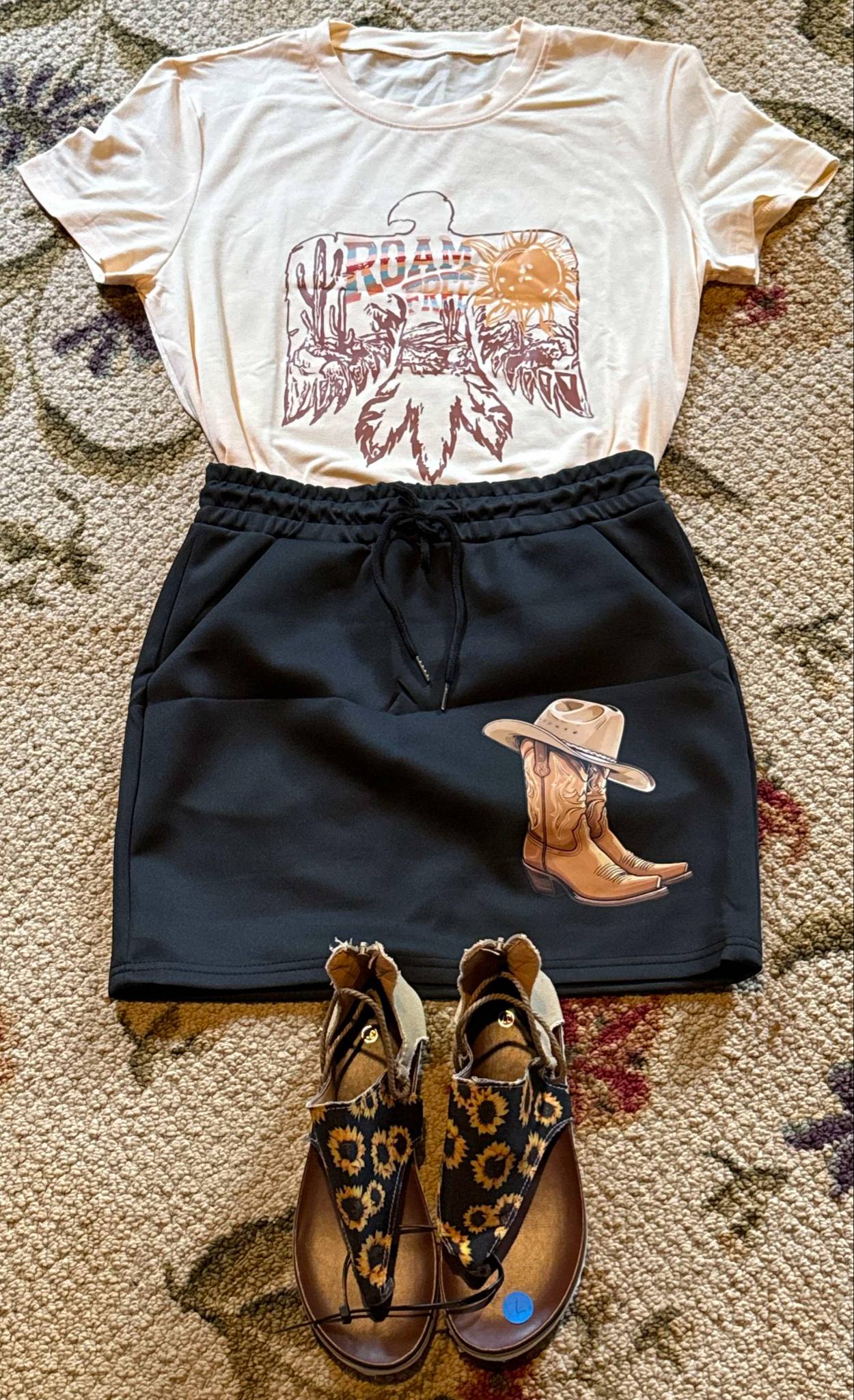 Black drawstring mini skirt with cowboy boots and hat patch