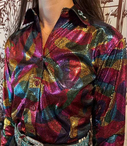 Close-up of a multicolor metallic rodeo-style shirt with a vibrant abstract pattern and embroidered collar